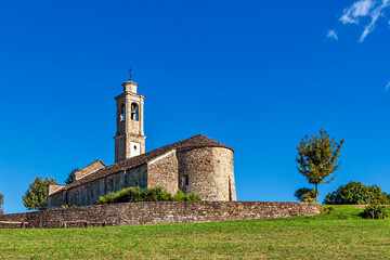 Old parish church under blue sky.