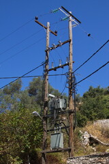 High voltage power line with a transformer on Crete in Greece, Europe

