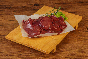 Raw chicken liver over board