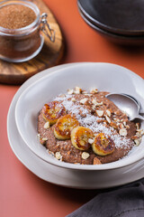 Teff grain porridge with banana topping for breakfast