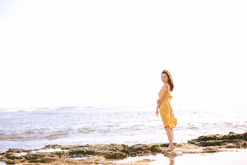 Girl wearing yellow dress at Diamond Head Beach Park
, Honolulu Oahu Hawaii