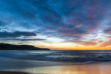 Sunrise at the beach with high cloud