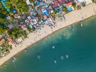 A typical resort town in the Philippines with buildings right up to the edge of the coastline. At Calayo, Nasugbu, Batangas.