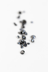 Black and white minimalist esthetics. Treated Black Diamonds,. Brilliant Cut Gemstones. Faceted