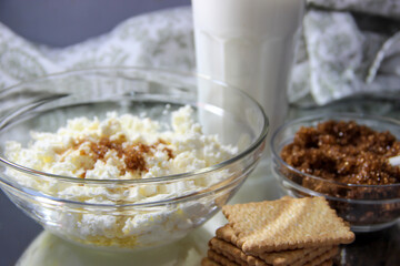 Still life breakfast milk, cottage cheese, cookies.