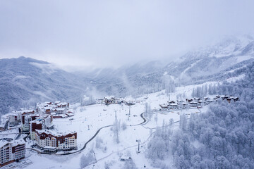 Winter aerial view of the Ski Resort Rosa Khutor. A complex of hotels on the site of the former Olympic village of Rosa Plateau at an altitude of 1170 m from sea level. Krasnaya Polyana, Sochi, Russia