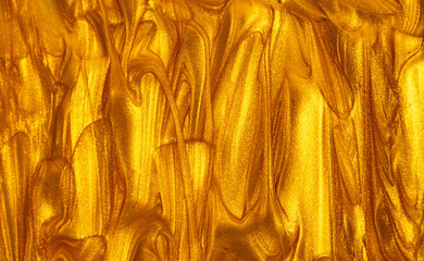 Golden paint texture with bright yellow highlights