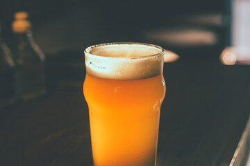 glass of beer on dark background