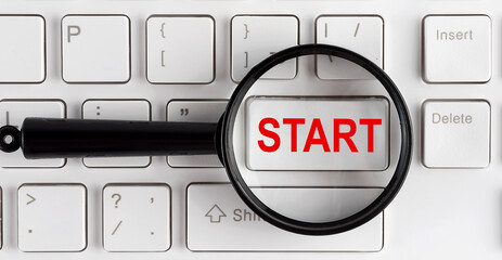 computer keyboard with word START on white button, closeup