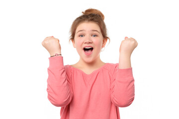 close up cheerful young girl raising her fists with smiling delighted face, yes gesture, celebrating success