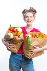 Healthy Eating and Lifestyle. Positive Caucasian Girl Posing With Eco Shopping Bag Filled With Vegetables. Vertical Image Orientation