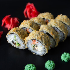 sushi on a black plate