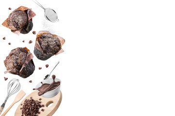 Chocolate muffins or cupcakes with set of kitchen utensils on white background. Copy space.