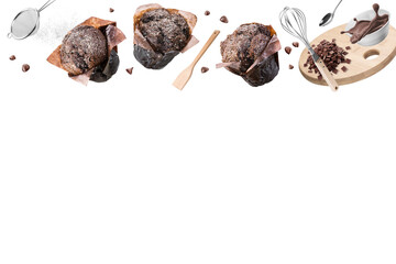 Chocolate muffins or cupcakes with set of kitchen utensils on white background. Copy space.