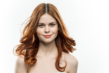 portrait of a woman with bare shoulders red hair cosmetics 