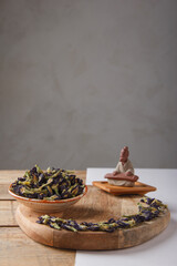 Chinese tea Anchan Tea. Dry loose Chinese tea leaves on wooden background. Space for text.