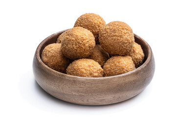 Mini scotch eggs in wooden bowl isolated on white