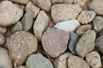 Old dry cobblestone pavement close up surface, texture for wallpapers