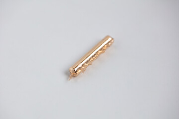 Rose Gold alloy bar after melting in jewelers workshop. Prepared for jewelry making