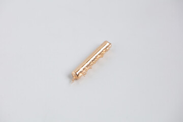 Rose Gold alloy bar after melting in jewelers workshop. Prepared for jewelry making