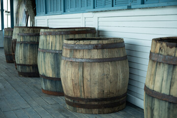 Barrels and closed wooden bar counter in restaurant outdoor