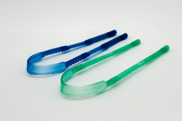 A picture of tungue cleaner isolated on white background