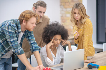 Young professionals working ona project and waiting for the results