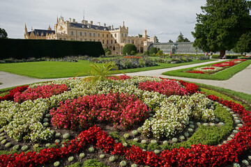 Castle Lednice Palace with beautiful garden with colourful ornamental flowers, popular touristic destination with guided tour, Lednice, Moravia, Czech Republic