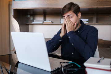 Stressed unhealthy businessman tired, overworked young man