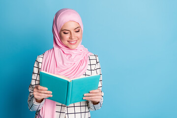 Photo of young attractive muslim girl happy smile red book novel wear white plaid suit isolated over blue color background