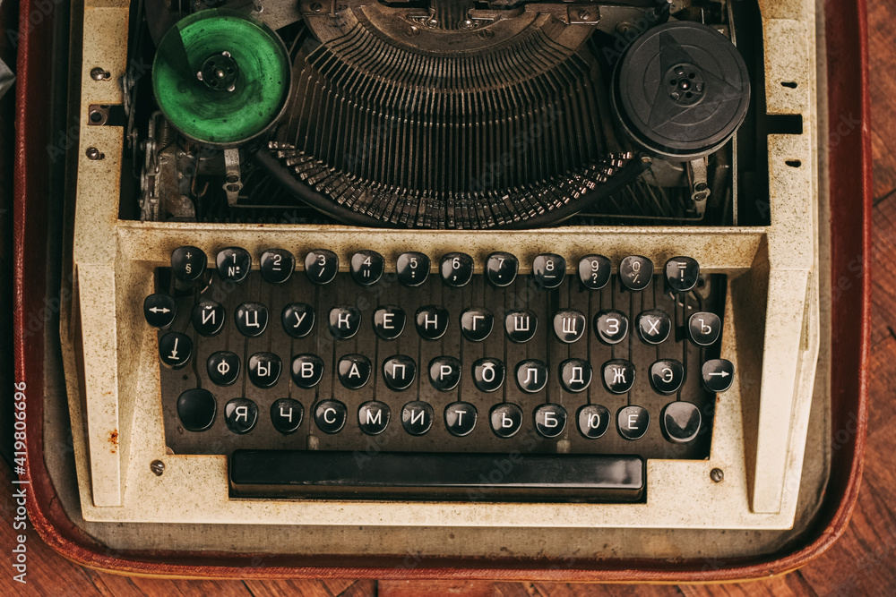 Poster typewriter with keys letters paper wood background texture
