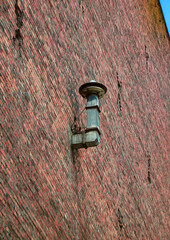 Warning horn, mounted to a brick wall