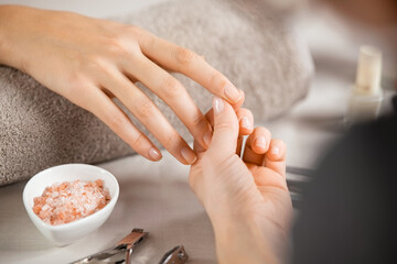 Woman hand care at nail salon