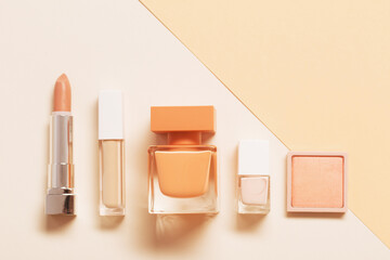 decorative cosmetics with perfume  on pastel  background