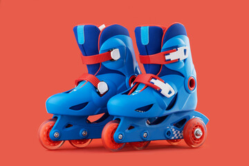 Roller skates isolated on red background