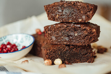 Chocolate brownie with hazelnut. Side view close up. Chocolate delicious texture