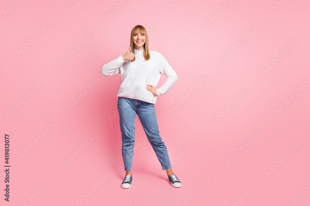 Wall mural full size photo of young happy cheerful woman showing thumb-up wear knitted sweater isolated on pink