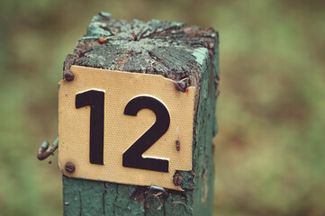 Photo of a pole with the number twelve