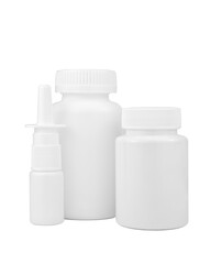 Two medicine plastic containers and nasal spray bottle isolated on white background. Pill bottle mockup. Pharmaceutical packaging. Vitamins and supplements jar.	