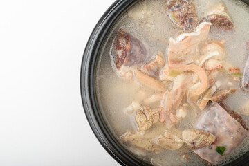 Pork intestines soup on white background