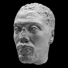 Antique head of the ancient man priest of Ancient Egyptian Isis with cracks sculpture. Face statue...