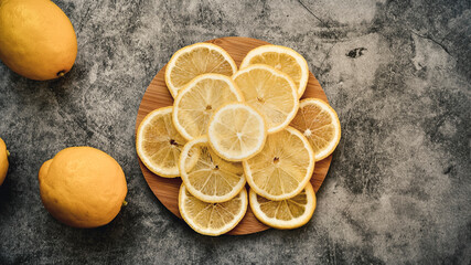 lemon slices on a round wooden board, space on the right side for writing