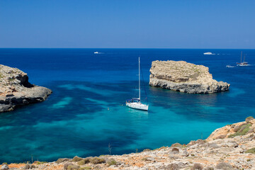 A yacht in blue waters of lagoons at Comino island, Malta
