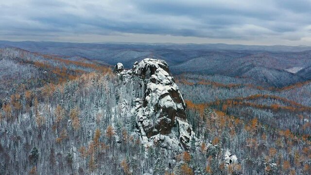 Eastern Sayans. Krasnoyarsk Pillars National Park. Siberian taiga in winter. Aerial view.
