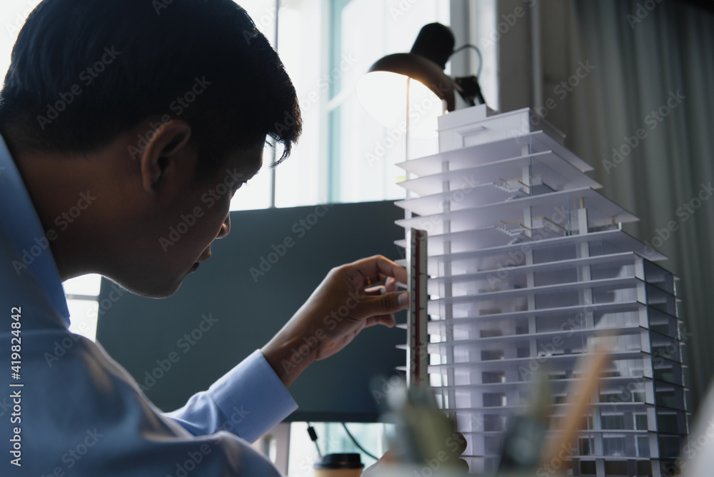 Poster architect's worked while sketching the details of the building, design from his idea stationery on d