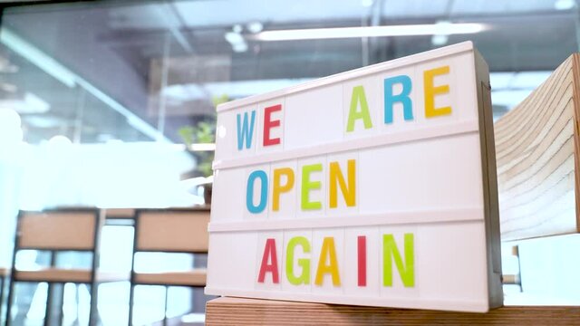 Lightboxes are open again. We're reopened after quarantine, small business owner video.