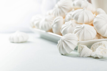 Fototapeta na wymiar Small white meringues.