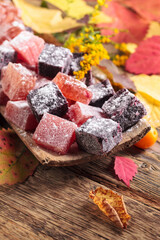 Solid homemade marmalade in an old wooden dish.