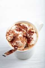 Hot chocolate and marshmallow sprinkled with chocolate chips.