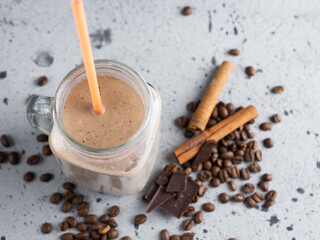 Glass jar of milk chocolate cocktail with coffee